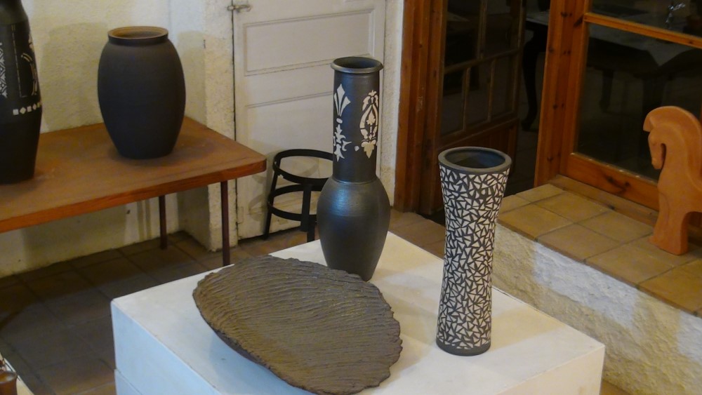 two painted high pieces, one flat and one wide neck