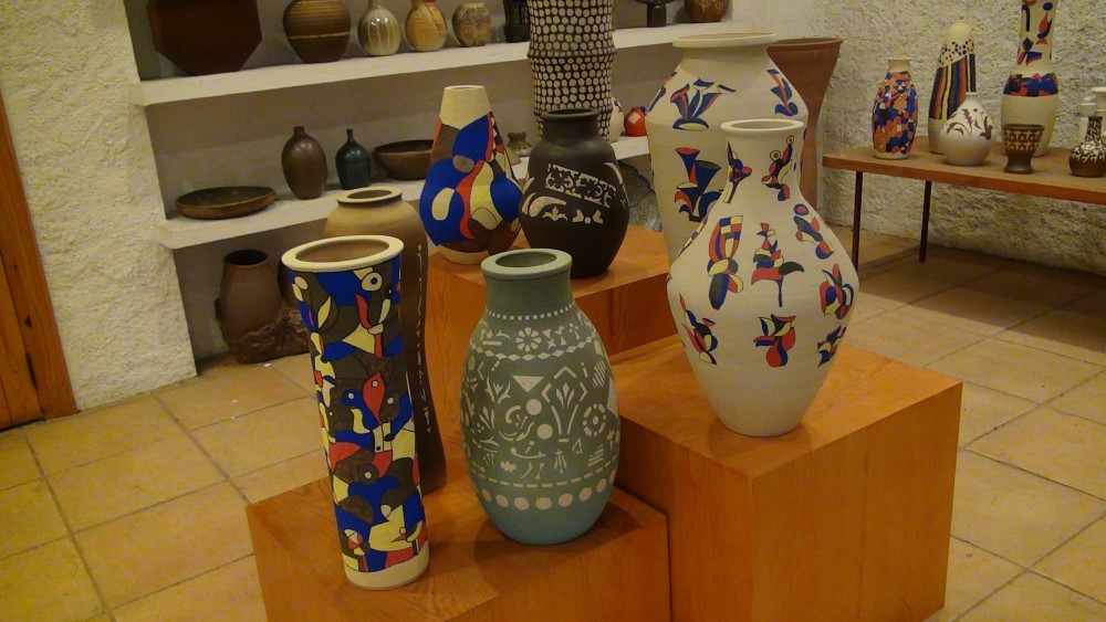 different pieces, some tall and narrow and others wider. All painted with different shapes